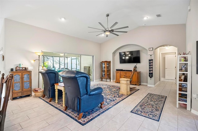 tiled living room featuring lofted ceiling and ceiling fan