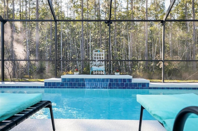 view of pool with a lanai