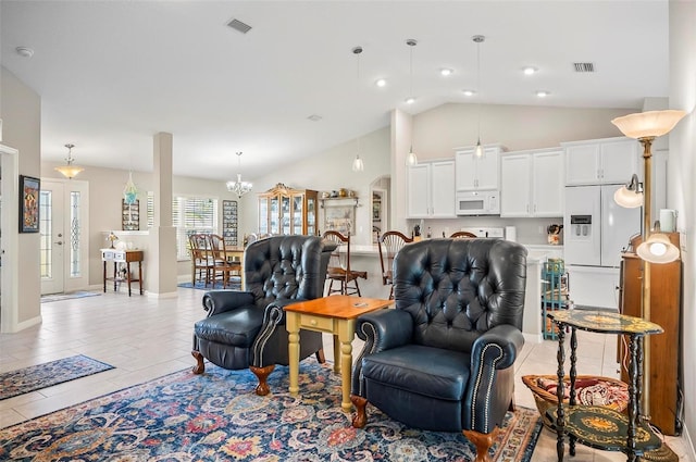 living room with vaulted ceiling and a notable chandelier