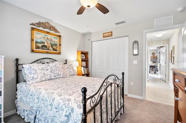 bedroom with carpet flooring, ceiling fan, and a closet