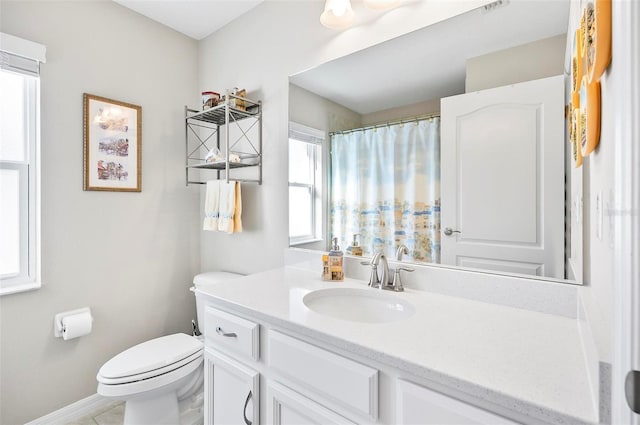 bathroom with vanity and toilet