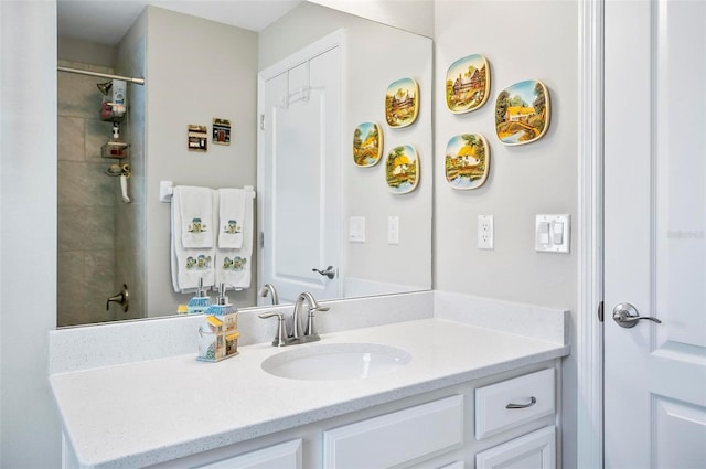 bathroom featuring vanity and a tile shower