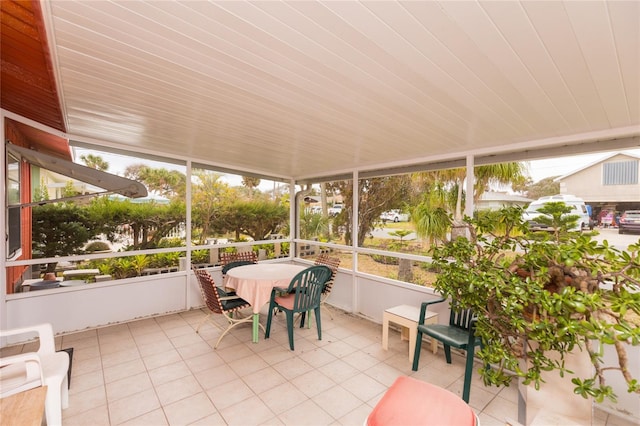 sunroom with wooden ceiling