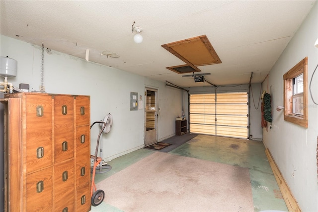garage featuring a garage door opener and electric panel