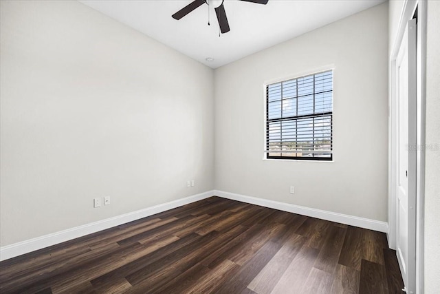 unfurnished room with dark wood-type flooring and ceiling fan