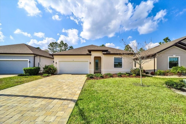 view of front of home featuring a garage and a front yard