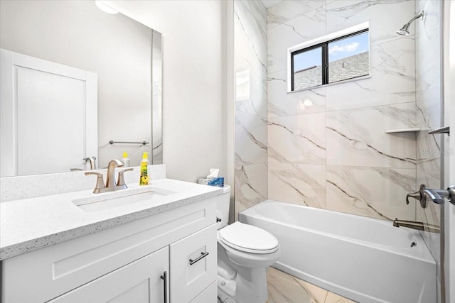 full bathroom with vanity, tiled shower / bath combo, and toilet