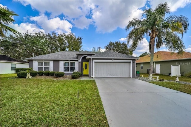 single story home featuring a garage and a front yard