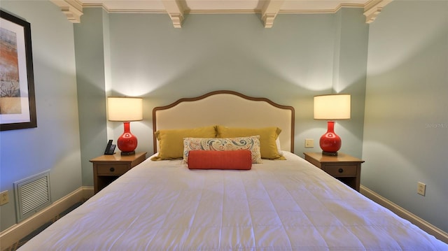 bedroom featuring visible vents and baseboards