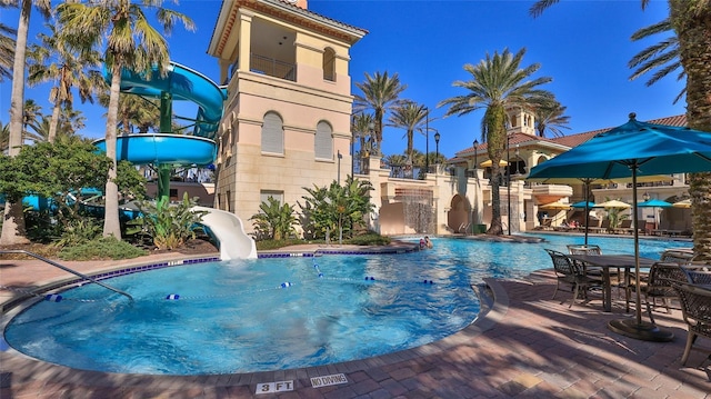 view of pool featuring a water slide