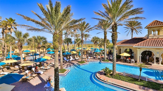 community pool with a patio area