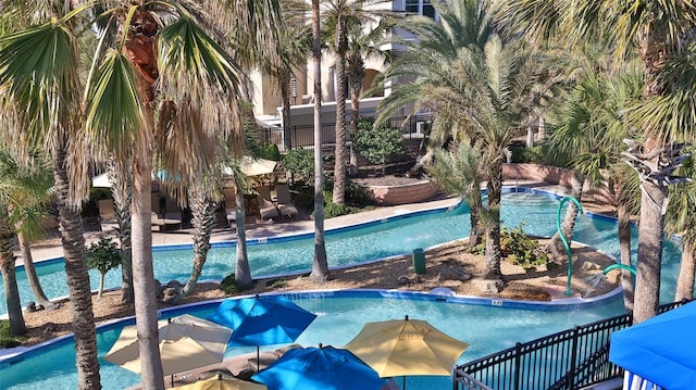 view of pool featuring fence