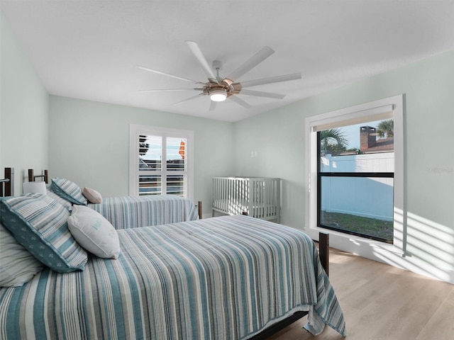 bedroom featuring ceiling fan and wood-type flooring