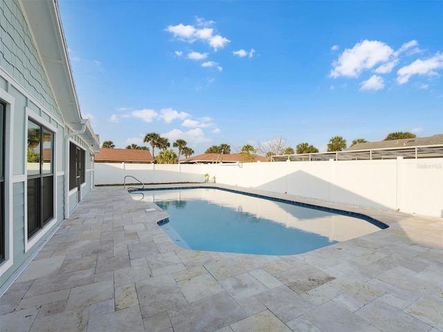 view of swimming pool with a patio area