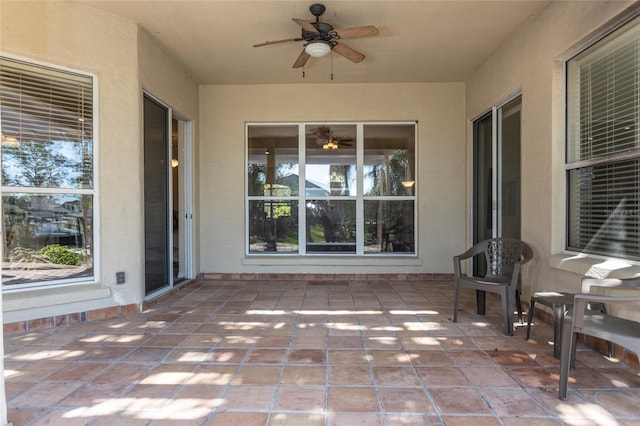 view of patio featuring ceiling fan