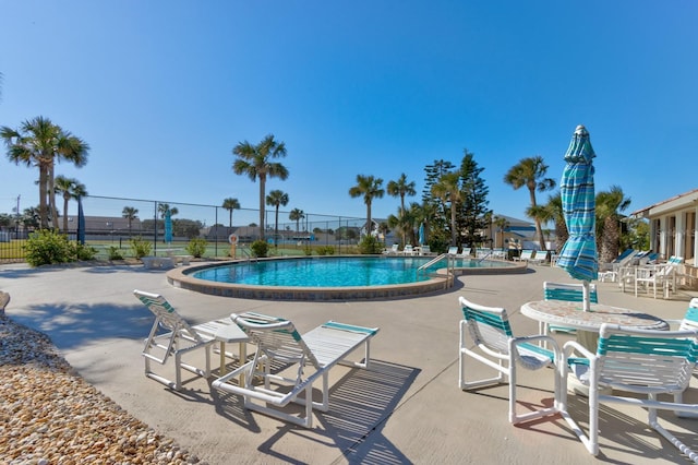 view of swimming pool featuring a patio area