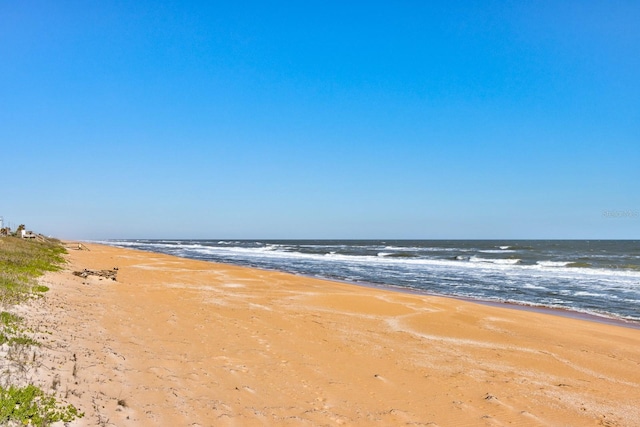 view of water feature with a beach view