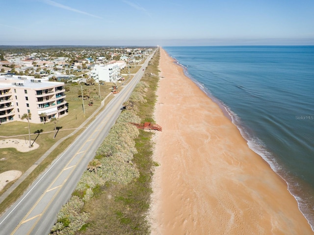 bird's eye view with a view of the beach and a water view