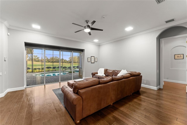 living room featuring ornamental molding, hardwood / wood-style floors, and ceiling fan