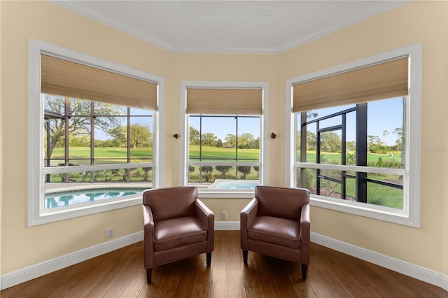 living area featuring ornamental molding and hardwood / wood-style floors