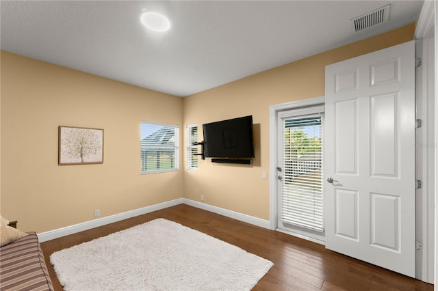 foyer entrance with dark hardwood / wood-style flooring