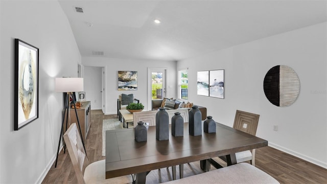 dining space featuring dark wood-type flooring