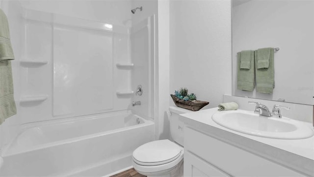 full bathroom featuring shower / bath combination, vanity, and toilet