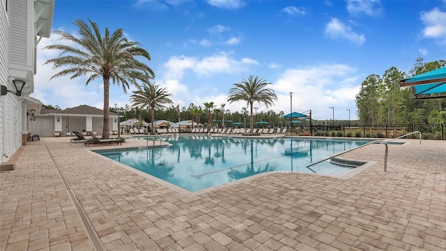 view of swimming pool featuring a patio area