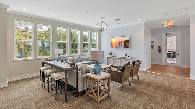 dining area with ornamental molding and light hardwood / wood-style flooring