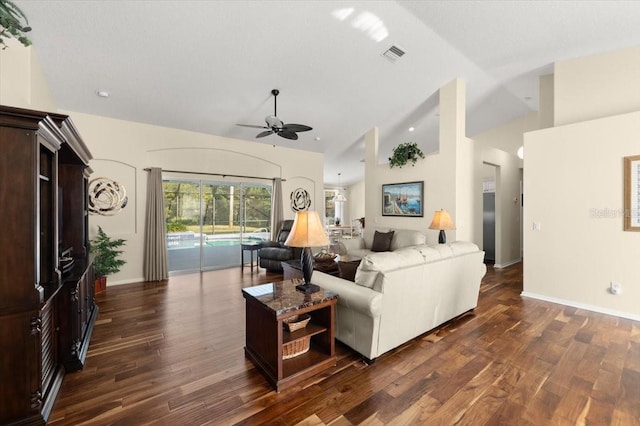 living room with high vaulted ceiling, dark wood-type flooring, and ceiling fan