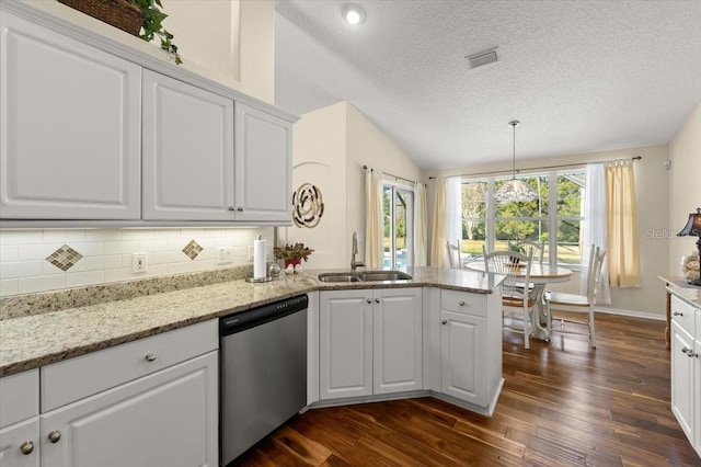 kitchen with sink, kitchen peninsula, white cabinets, and dishwasher