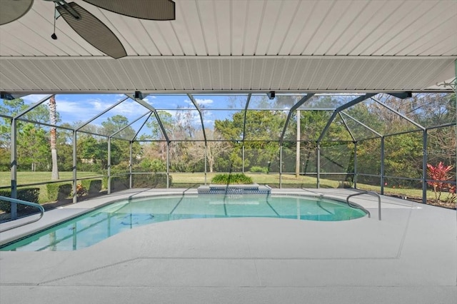 view of swimming pool featuring a lanai and a patio area