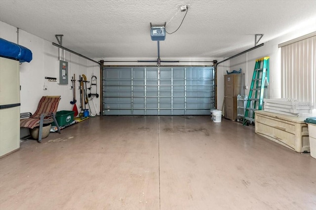 garage with a garage door opener and electric panel