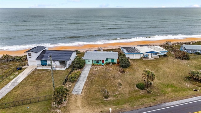 aerial view with a water view and a view of the beach