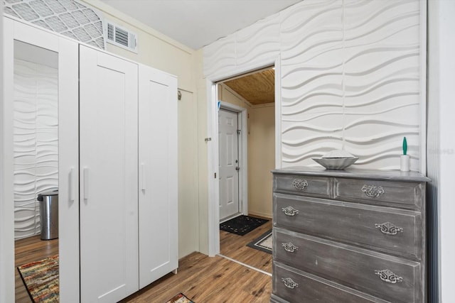 corridor with dark hardwood / wood-style flooring