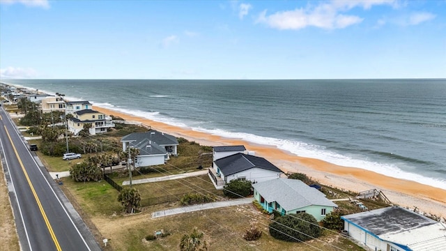 aerial view featuring a view of the beach and a water view