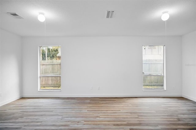 spare room featuring light wood-type flooring