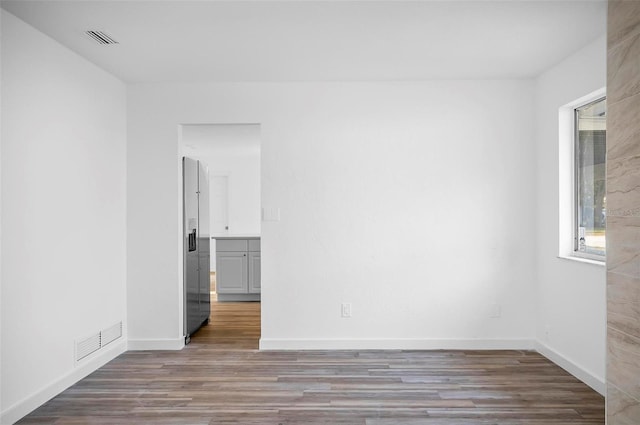 empty room with wood-type flooring