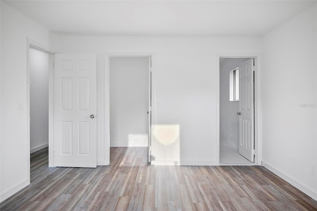 unfurnished bedroom featuring wood-type flooring