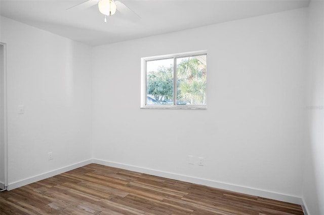 empty room with hardwood / wood-style flooring and ceiling fan