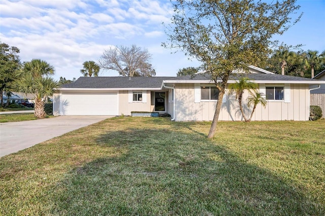 single story home featuring a garage and a front lawn