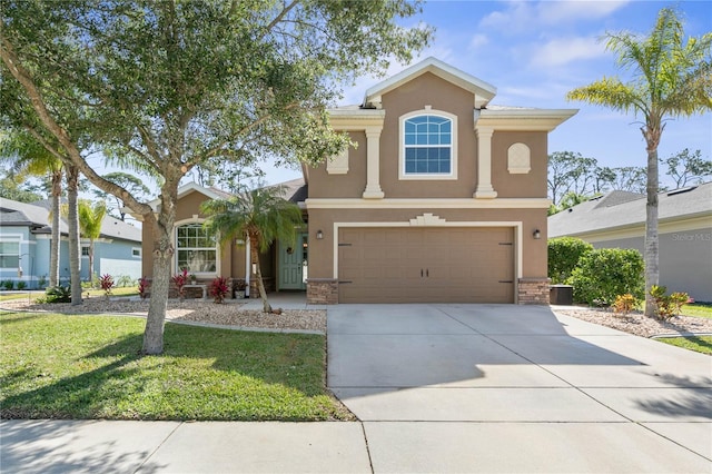 view of front of property with a garage and a front yard