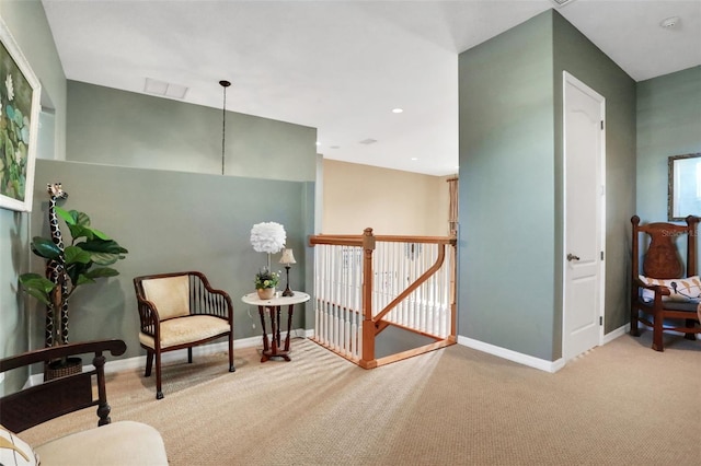 sitting room with light colored carpet