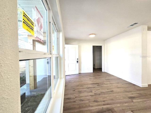 hallway featuring dark hardwood / wood-style floors