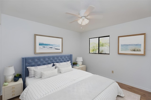 bedroom featuring hardwood / wood-style floors and ceiling fan