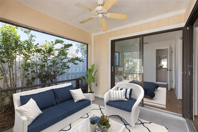 sunroom featuring ceiling fan