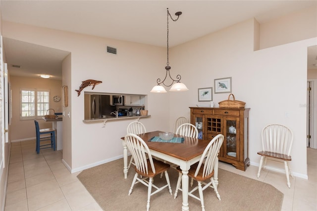 dining space with light tile patterned flooring