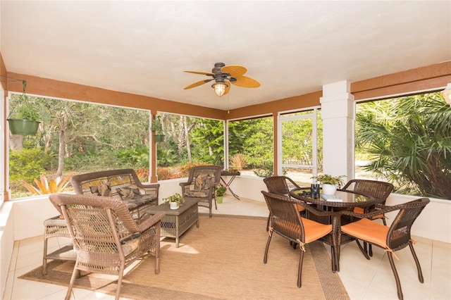 sunroom featuring ceiling fan