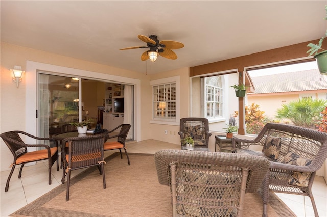 sunroom / solarium with ceiling fan