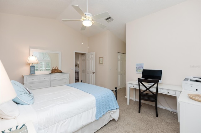 bedroom with ceiling fan, light colored carpet, and vaulted ceiling